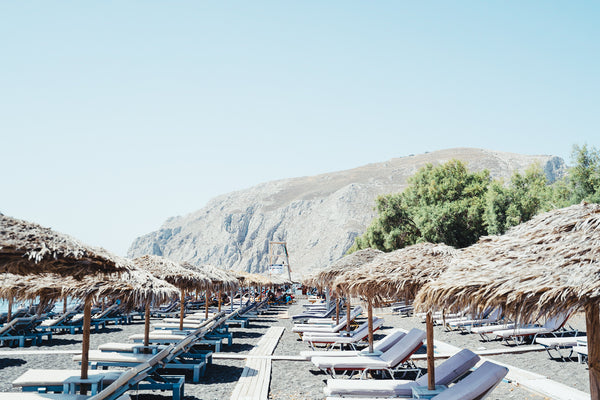 Seafront Kamari Beach features a long stretch of volcanic black-sand and pebble beach of the same name, overlooked by nearby Mesa Vouno Mountain. Scuba-diving centers and jet ski rental spots line the waterfront, among al fresco late-night bars, upscale cocktail lounges, and seafood tavernas. Inland, lively streets are packed with souvlaki cafes and Irish pubs, as well as vacation villas and luxury hotels